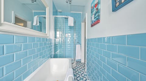 End the day with an unrushed soak in the bright blue bathtub