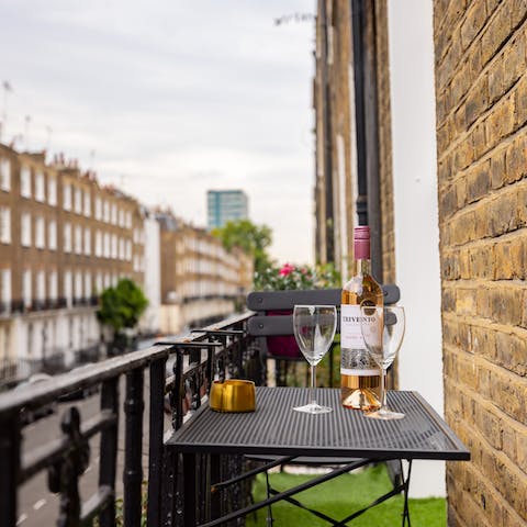 Sit out on the compact balcony to enjoy a glass of wine at the end of the day