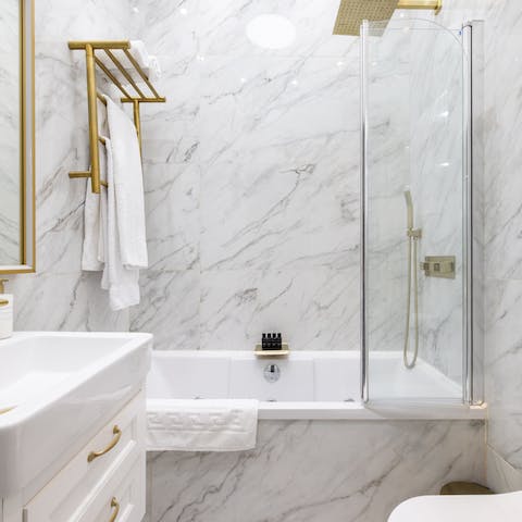 Feel like royalty with a soak in the marble and gold tub