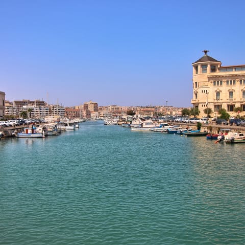 Take a boat tour around Ortigia and enjoy the sights from the sea