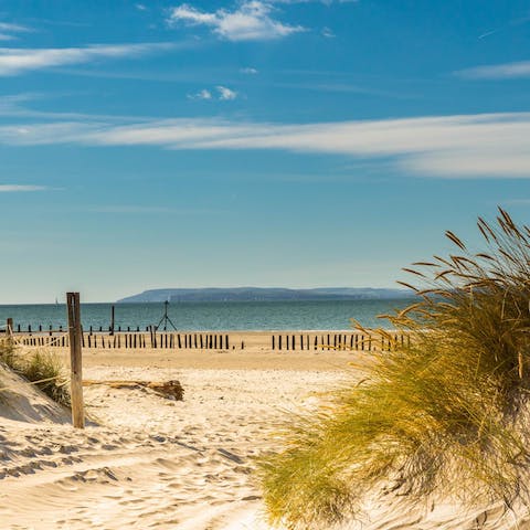 Embrace barefoot strolls on East Wittering Beach