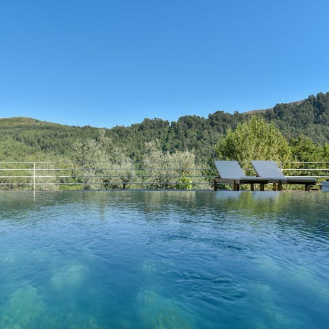 Float in the private pool amidst stunning natural views