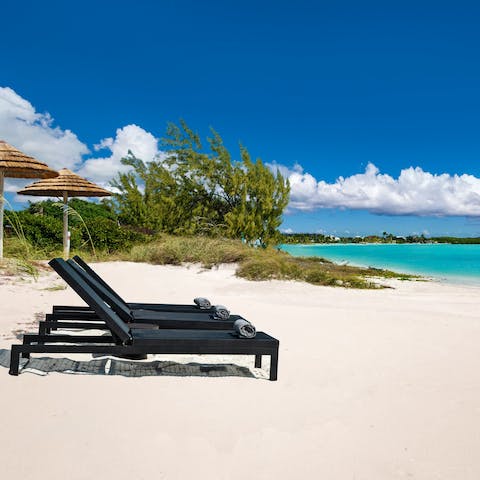 Relax on the white sands of Long Bay Beach – on your doorstep