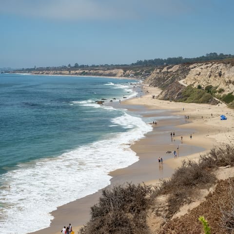 Drive twenty minutes to the pristine shores and clean surf of Newport Beach