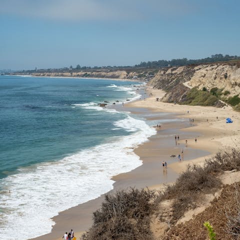 Drive twenty minutes to the pristine shores and clean surf of Newport Beach
