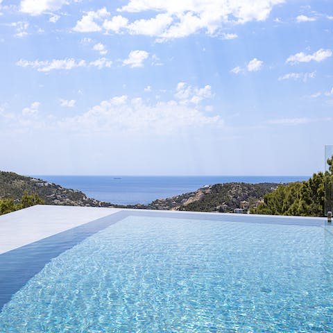 Paddle about in the sleek swimming pool and admire the view of endless blue beyond