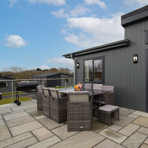 Fire up the charcoal barbecue and dine alfresco on the private deck 