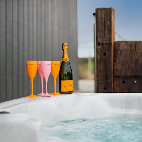 Pour yourself a glass of bubbly and enjoy an evening in the hot tub