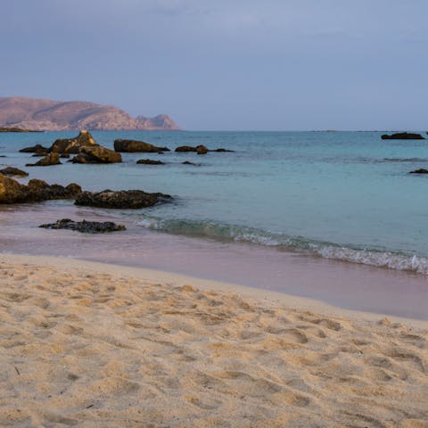 Feel the sand between your toes on Kalathas Beach, a short walk away