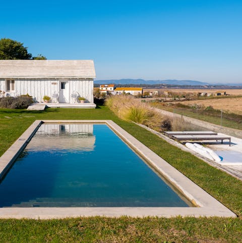 Take a morning dip in the private swimming pool, or simply enjoy the view from a sun lounger