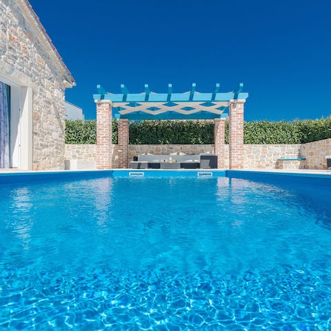 Cool down in this beautifully clear pool under the Mediterranean  sun