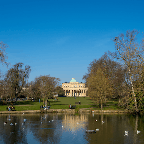 Relax in Pittville Park after explore Cheltenham, a fifteen-minute drive away