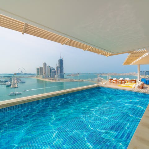 Soak in the stunning views of the city from the private balcony swimming pool
