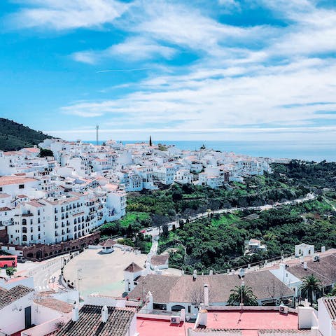 Explore historic Frigiliana with its narrow streets decorated with ceramic mosaics