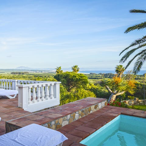 Gaze out from the infinity pool at the Strait of Gibraltar and the Atlas Mountains of Morocco 