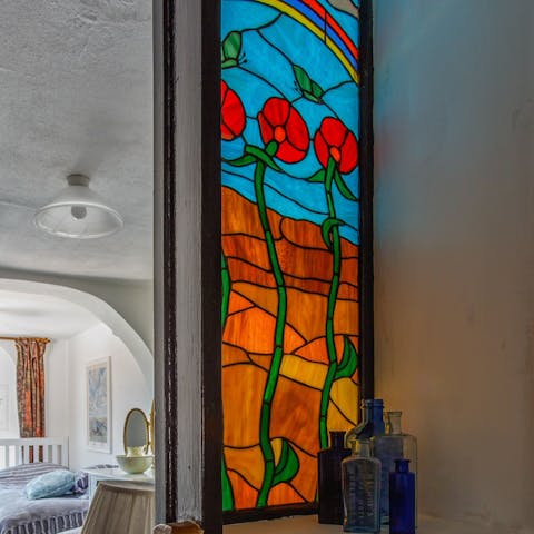 Admire the beautiful stained glass windows upstairs