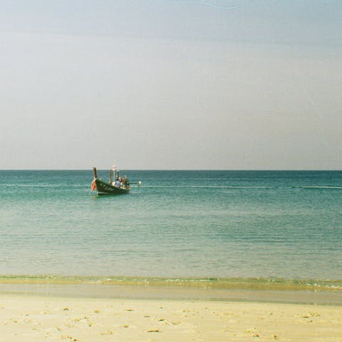 Laze on nearby Bang Tao Beach