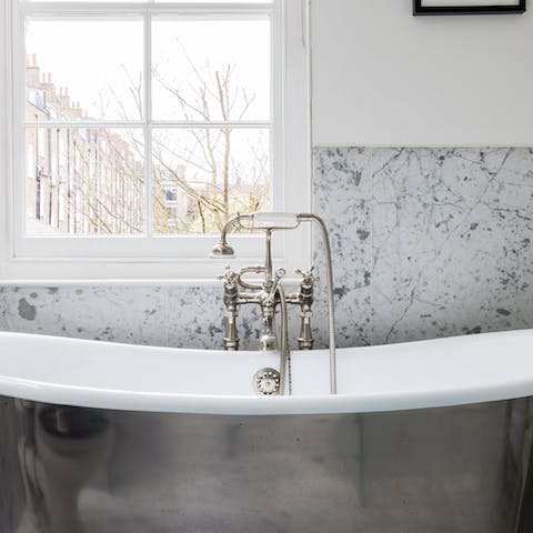 Sink a little deeper in the opulent roll-top bathtub 