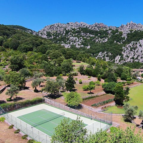 Wander the sprawling grounds and find the tennis court tucked away