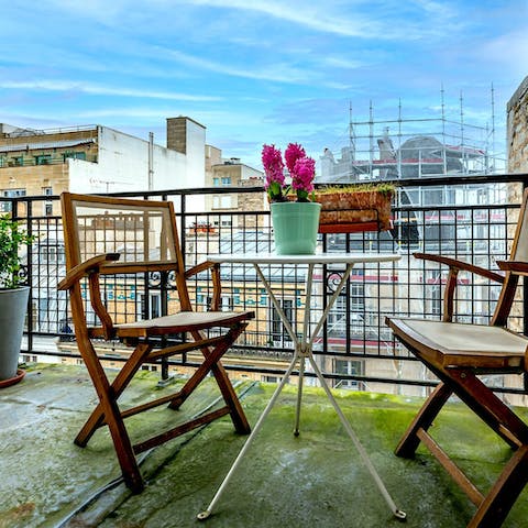 Start your day with a cup of coffee out on the balcony