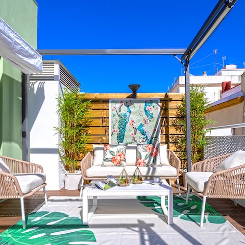 Savour a cool glass of white wine on the sun-drenched terrace