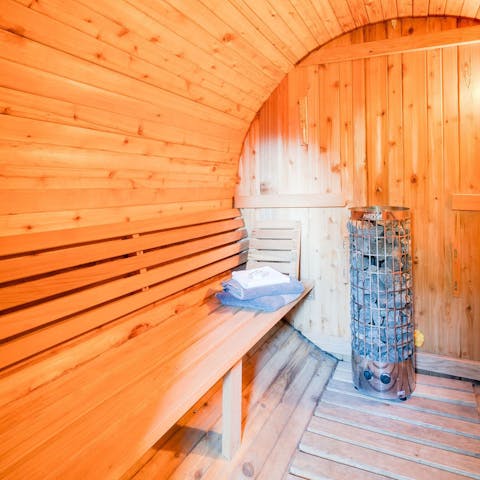Step into the barrel sauna and embrace the relaxation 