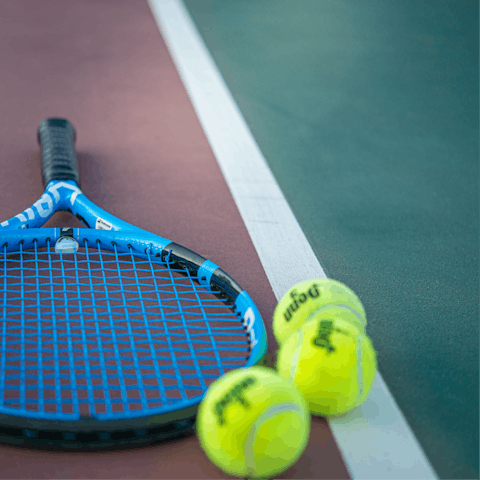 Play a game of doubles on the shared tennis court