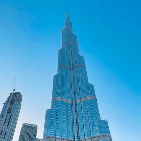 Make a stop at the mesmerising Burj Khalifa – just a twenty-minute train ride away