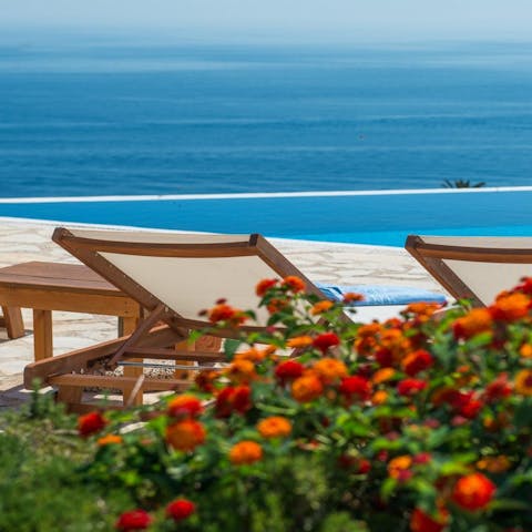Sunbathe while taking in the soothing sea vistas on the terrace 