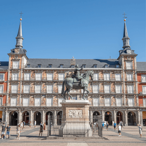 Hop on a bus to the lively Plaza Mayor and try local cuisine