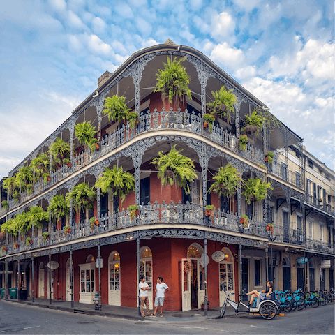 Gaze up at the colourful buildings and cast-iron balconies of the historic French Quarter, a stone's throw away