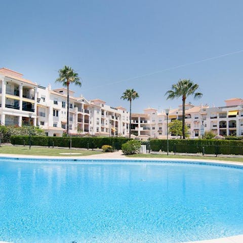 Soak up the Andalusian sunshine from the shared poolside
