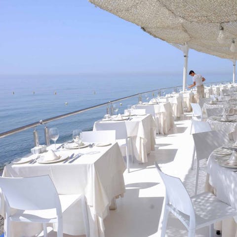 Find a sunny spot at Marbella's seafront restaurants, just a five-minute drive away