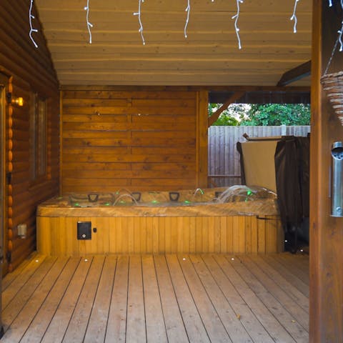 Grab a glass of wine and relax in this large, private hot tub