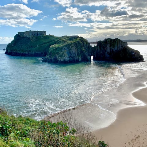 Soak up the sunshine on Castle Beach, a ten-minute walk away