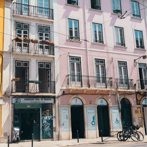 Wander the steep cobbled streets of Lisbon's bohemian Bairro Alto district, a twenty-five-minute stroll away