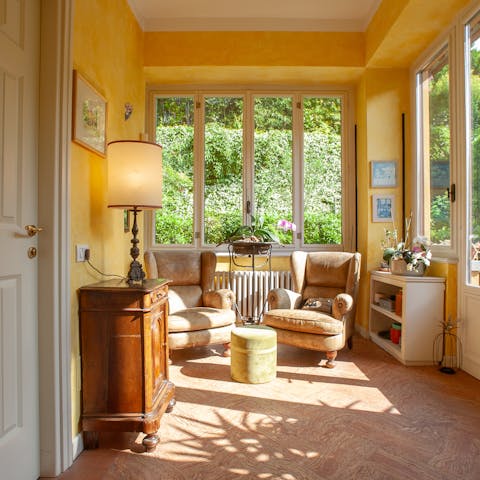 Curl up with a book in the cosy yellow sunroom