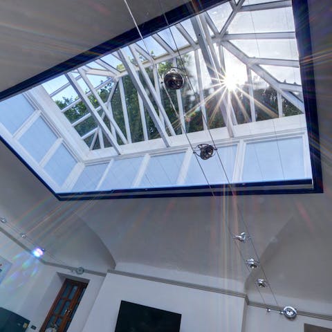 Admire the charming Victorian skylight in the living area