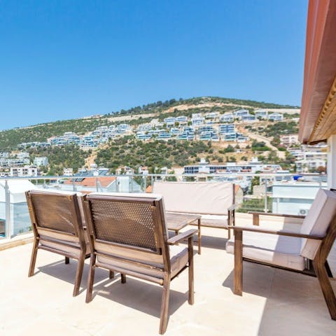 Sip raki on the balcony and watch the sun go down