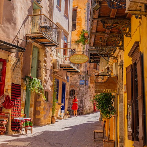 Explore the labyrinthine backstreets and charming Venetian harbour of Chania, a half-hour drive away