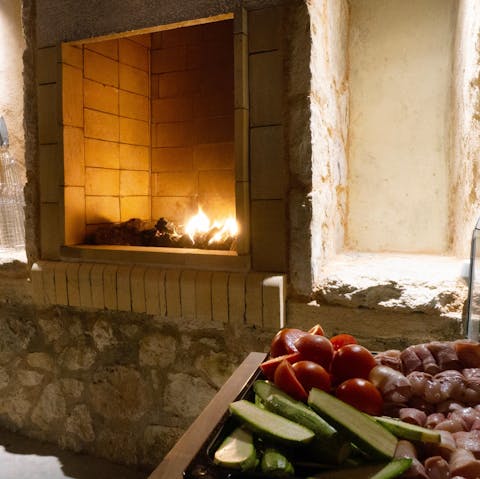Cook Cretan style, on the wood-fired barbecue oven