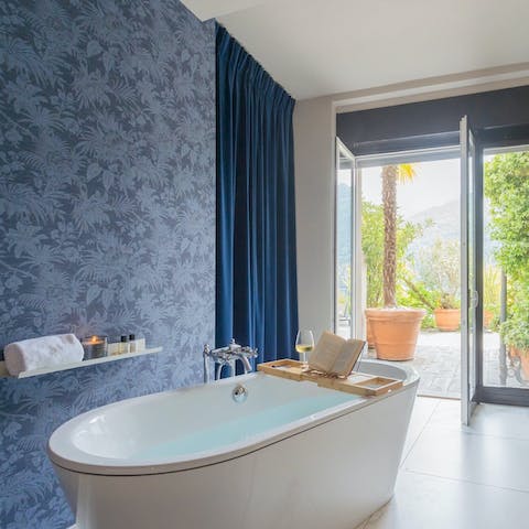 Slip into the bath for a bit of self-care, with the landscape on the horizon