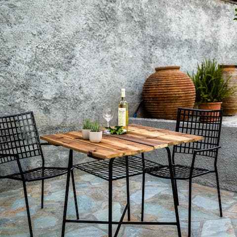 Share a bottle of Greecian wine and nibble on Kalamata olives on the sun-kissed patio 
