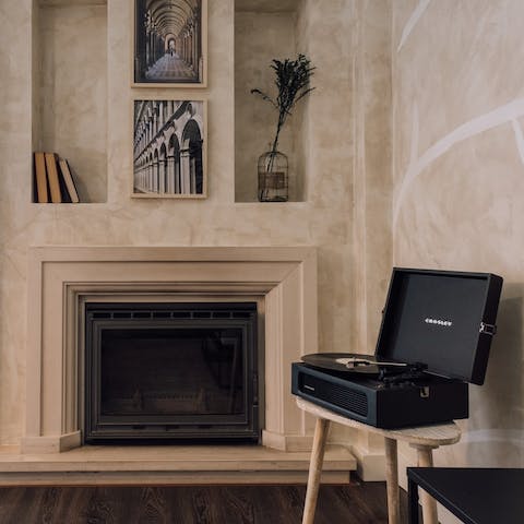 Put a record on the vinyl player and unwind in the cosy living area