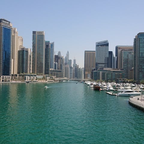 Explore Dubai Marina, a thirteen-minute drive away