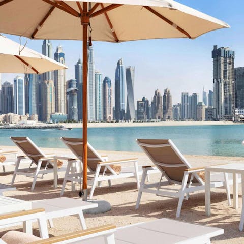 Spend afternoons on the private area of Palm Jumeirah Beach, a three-minute walk away