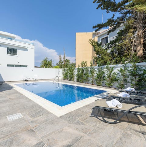 Jump into the home's private pool and dry off naturally on one of the loungers