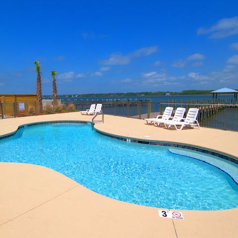 Relax in the sunshine by the communal pool