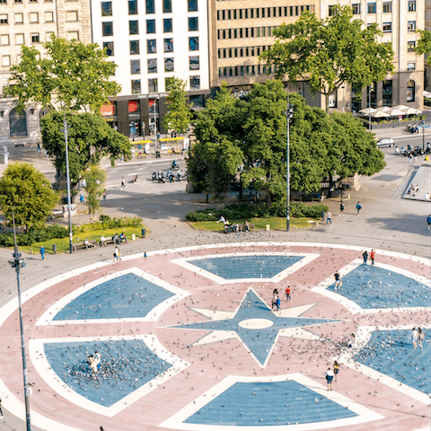 Turn left and arrive at the iconic Plaça Catalunya