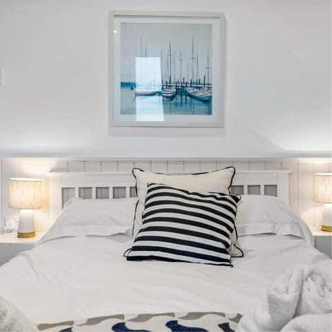 Snuggle up in the cosy bed after a long day in the fresh coastal air